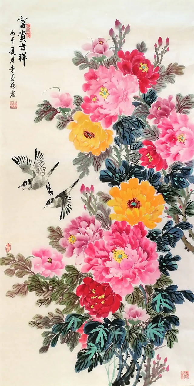 A tall painting of a peony plant in full bloom, crimson, pink and two yellow flowers stacked from bottom to top, with two small black-capped birds flying in from the left and a column of calligraphy at the upper left.