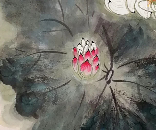 A broad lotus leaf in wet, splashed ink, with a bud rising above it.