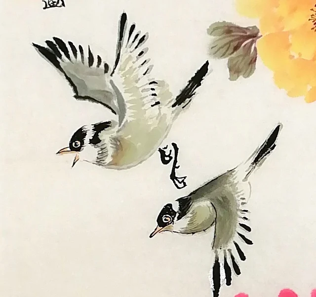 Two small birds dart in, one with wings spread, one wheeling round.