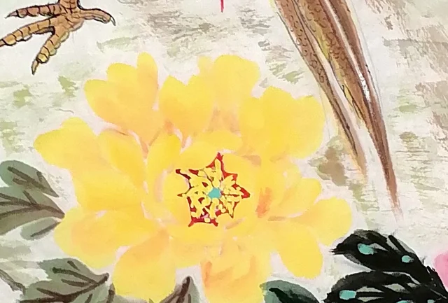 A bright yellow peony at the centre.