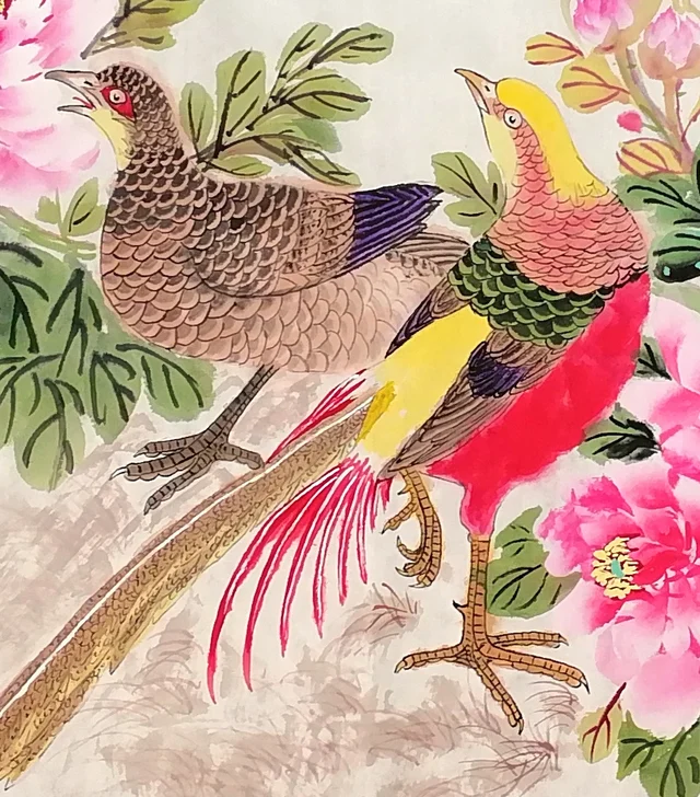 The pheasant pair face each other, heads raised.