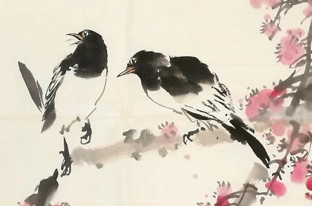 A pair of magpies facing each other on the plum branch.
