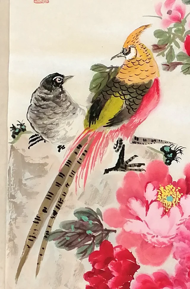 The pheasant pair; the male’s flame-like crest and long tail.