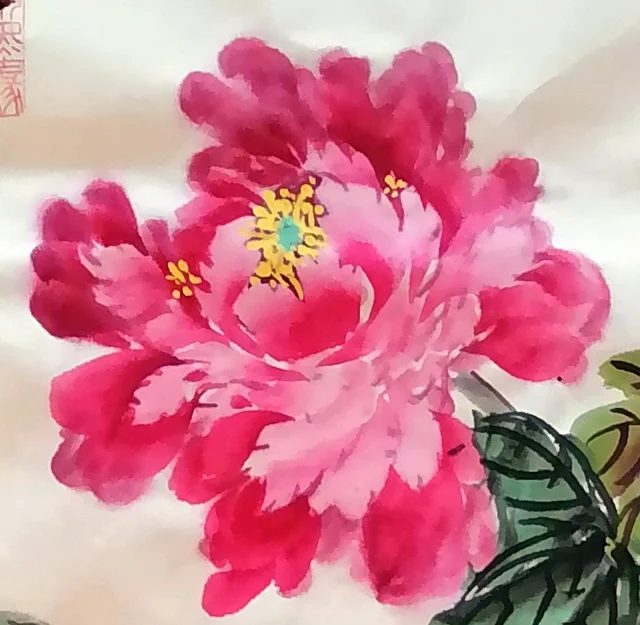 The deep rouge peony at the top, shaded layer on layer.