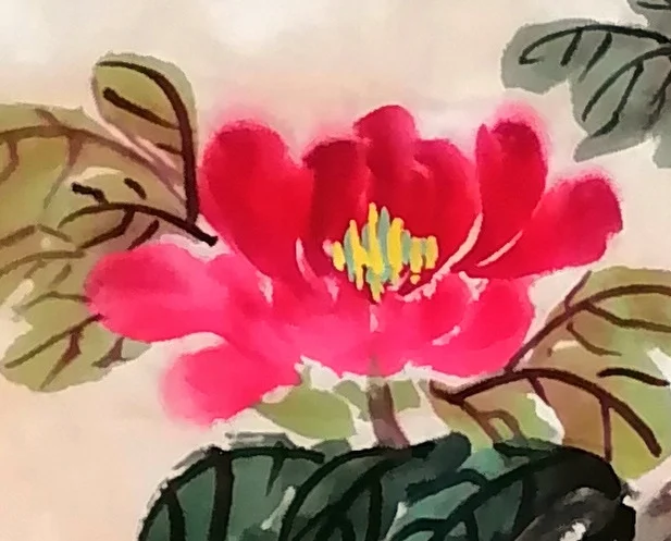 A single crimson flower reaching out.