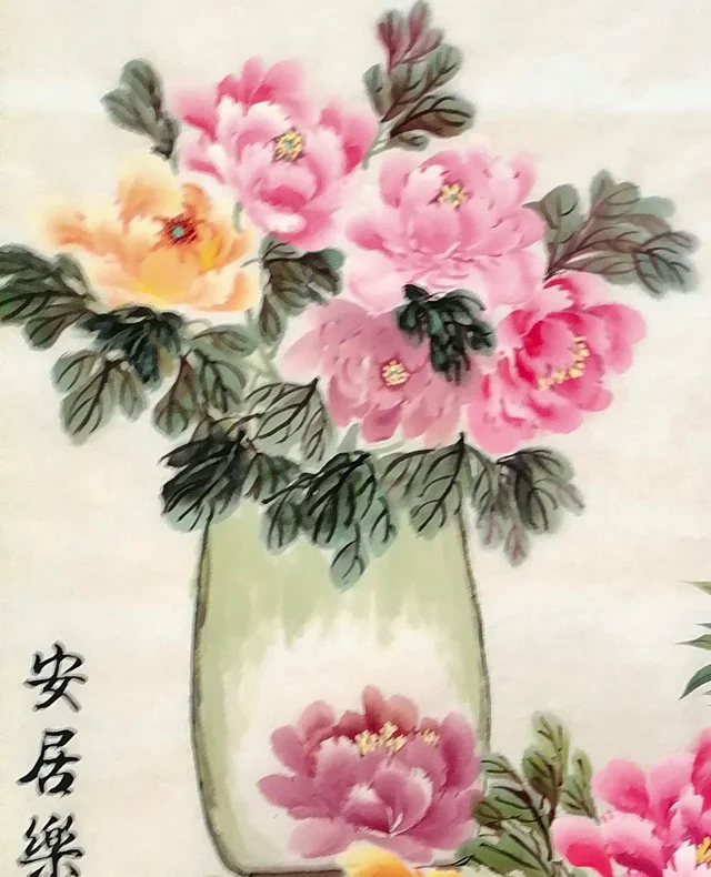 The celadon vase with its spray of peonies.