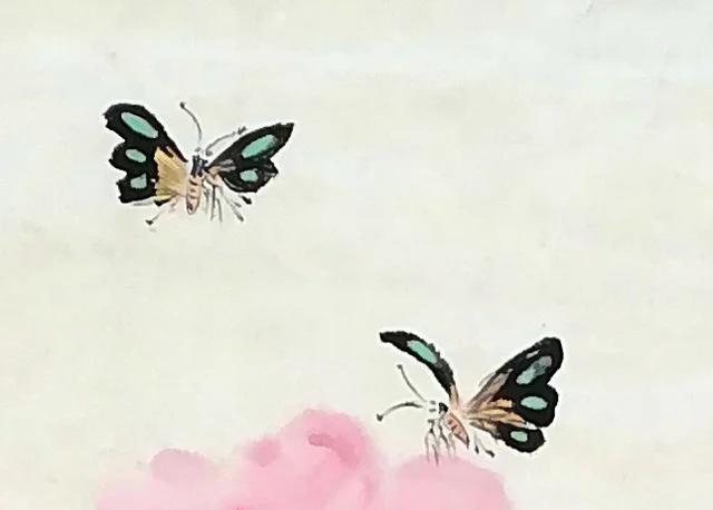 Two butterflies at the top, their wing markings clear.