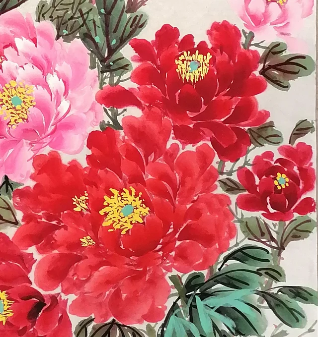 A mass of crimson peonies with golden stamens.