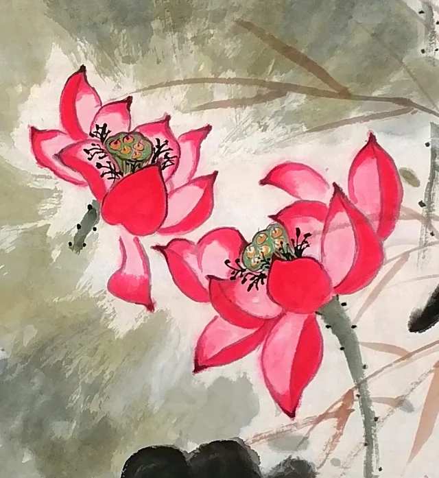 Two red lotuses rising from the water.