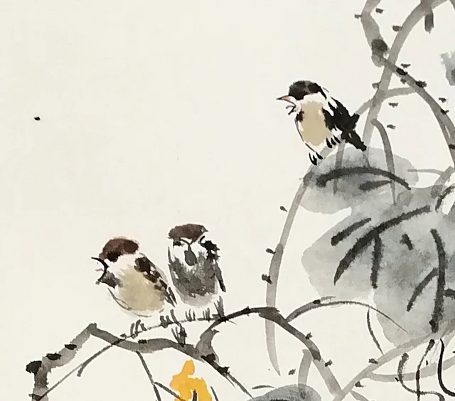 Three sparrows on the trellis.