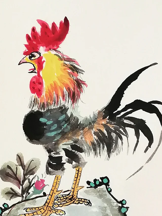 The rooster’s red comb, golden neck and curling tail.