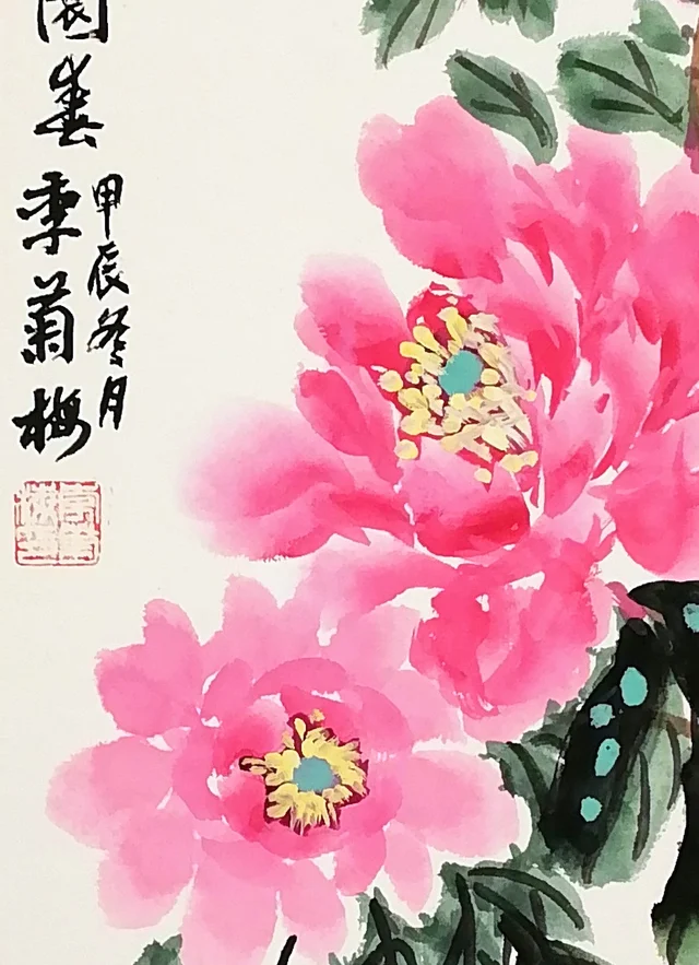 Two peach-red peonies with golden stamens.