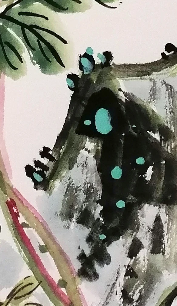 The corner of rock in dark ink with green moss.