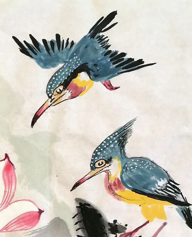 The two kingfishers, one diving, one perched.