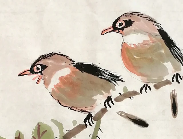 The pair of small birds perched together.