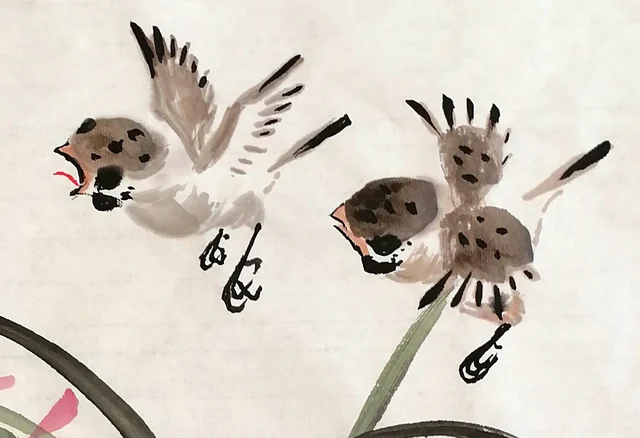 Two sparrows flapping and chattering.