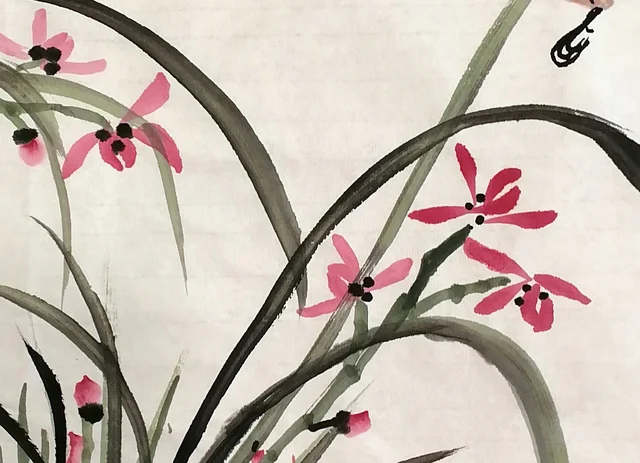 Pink-violet orchids, each with a dark dot.