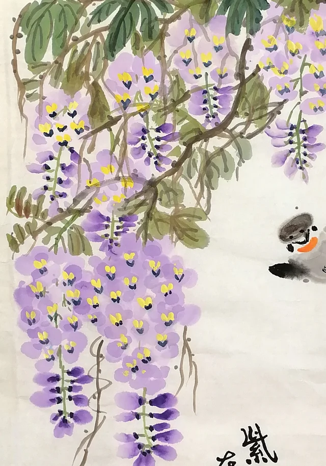 A great cluster of wisteria hanging from the top.