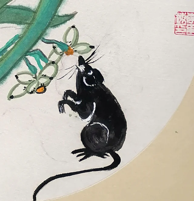The mouse standing up to look at the flowers.
