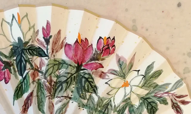 Purple and white magnolias with orange hearts.