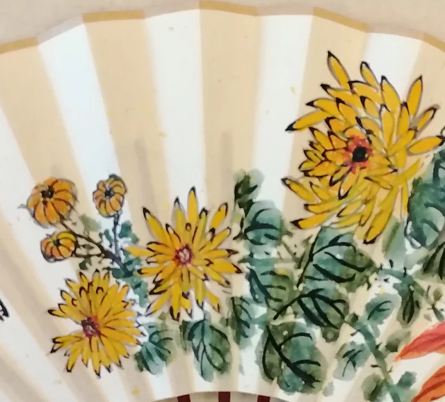 Golden chrysanthemums outlined in ink.