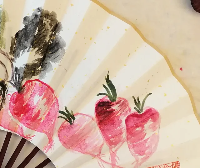 Four radishes painted in rouge.