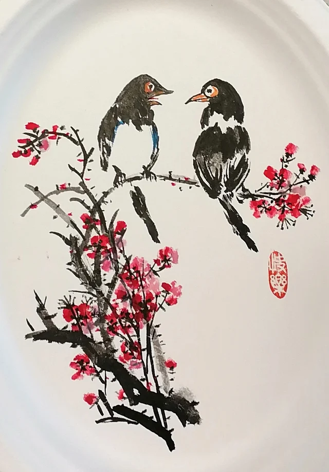 The pair of magpies facing each other.