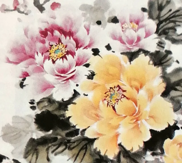 A rouge peony beside a large golden one.