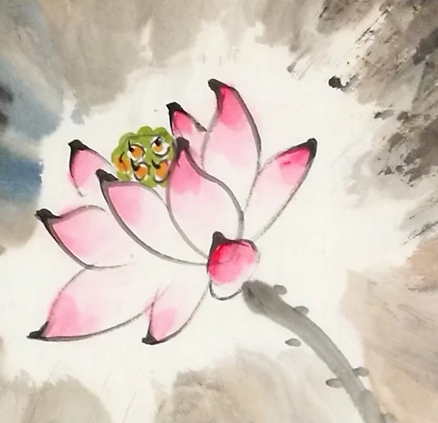 A pink lotus at the heart of a leaf.