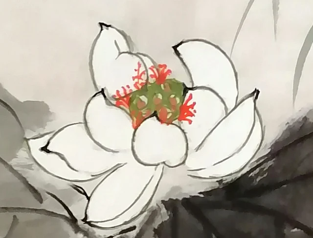 The upper white lotus, its petals the white of the paper.
