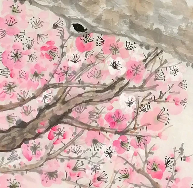 Crowded pink blossoms with fine dark stamens.