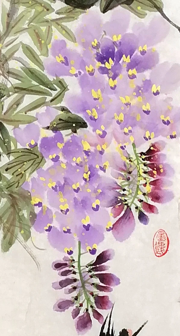 A hanging cluster at the right, violet touched with red.