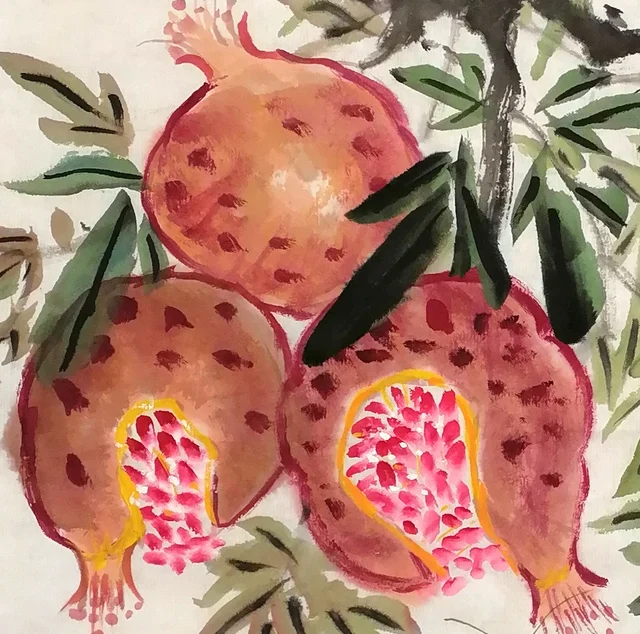 Split pomegranates with glistening seeds.