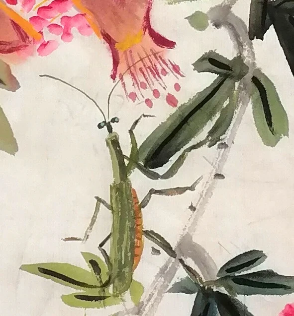 The slender insect on a twig.