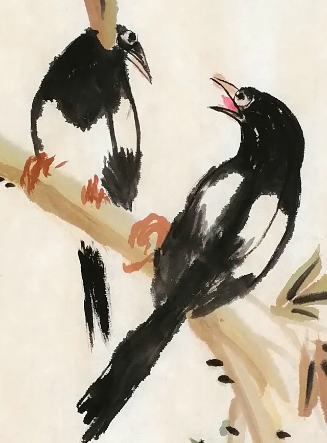 The magpie pair, one looking down, one calling up.