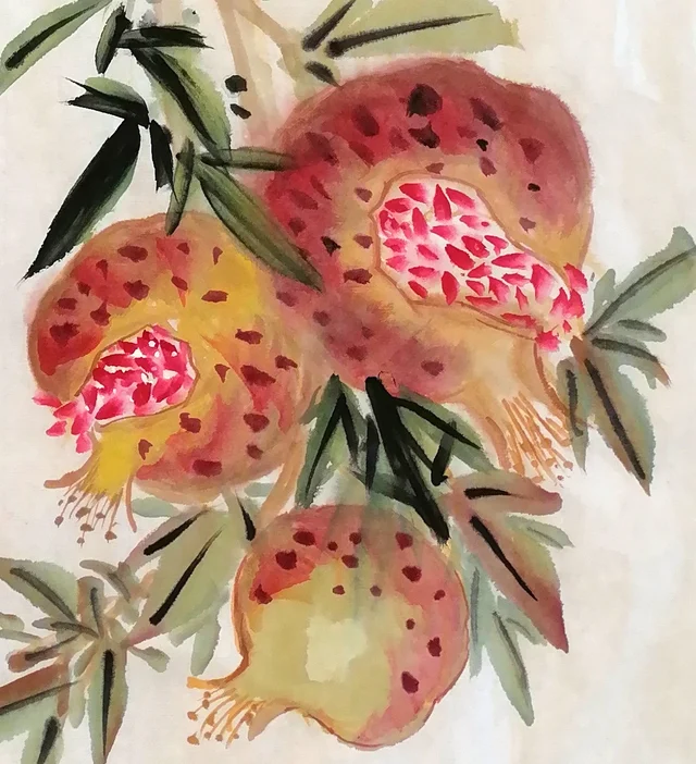 Three pomegranates at the lower right, split open.