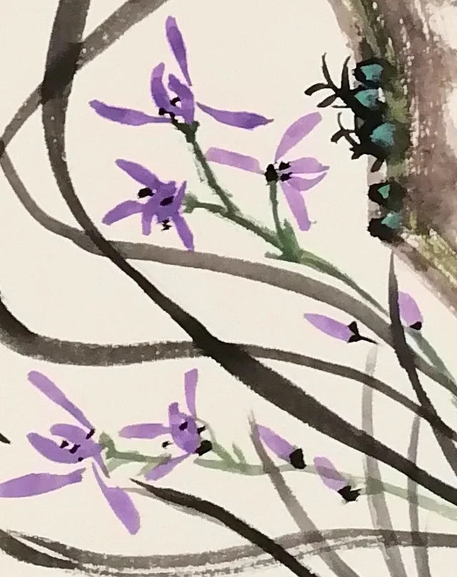 Orchid leaves with purple flowers.