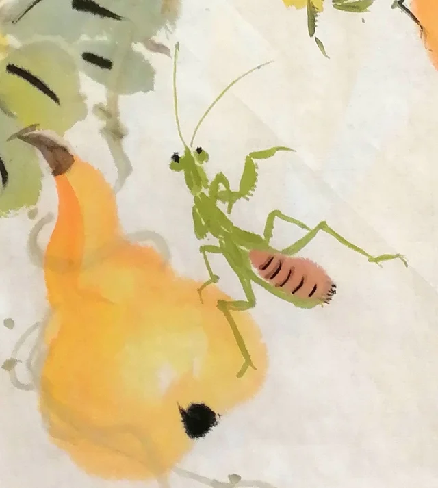 The mantis on the lowest gourd.
