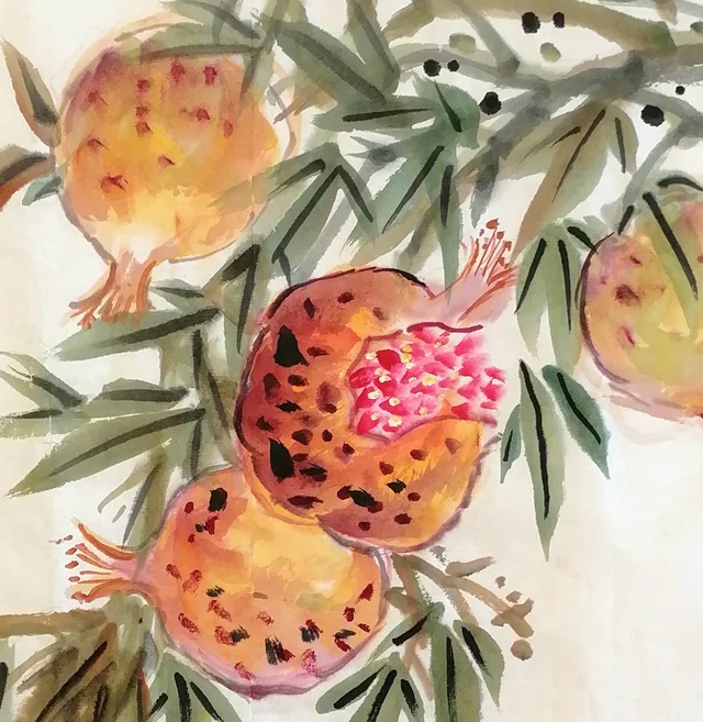Split pomegranates with crimson seeds.
