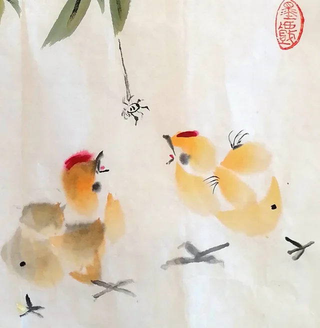Two chicks looking up at a spider on its thread.
