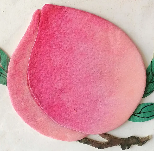 The peach: two overlapping pieces of pink cloth dyed from deep to pale.