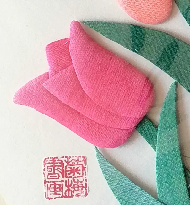 A pink tulip leaning out, with the square seal below.