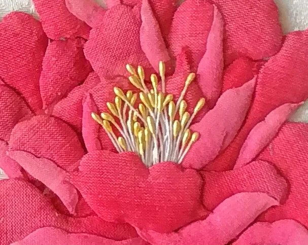 The yellow-tipped stamens at the heart of the flower.