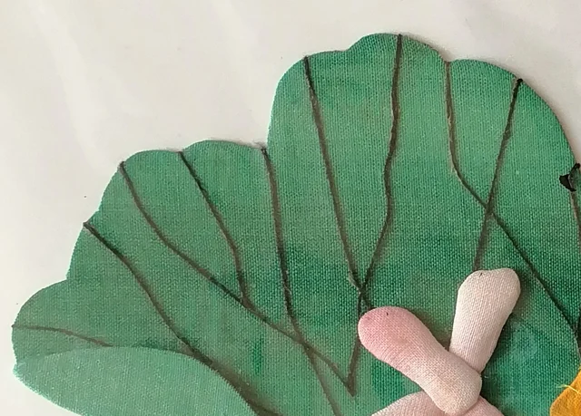 The lotus leaf, green cloth veined in ink.