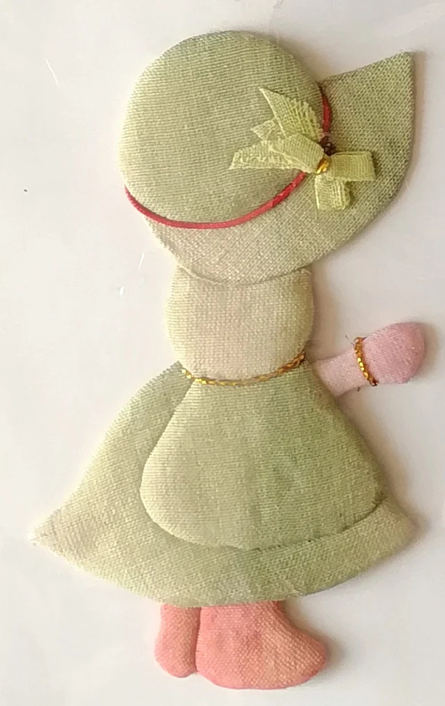The girl in sage green, with a ribbon bow and gold-cord bracelet.