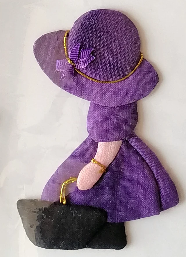 The girl in purple with her little black bag.