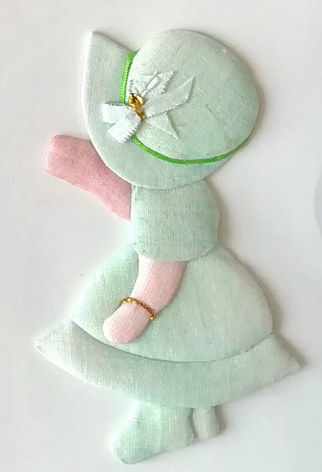 The girl in mint, waving.